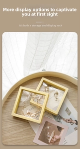 Detailed view of yellow PE film jewelry display boxes in a cozy home setting with props