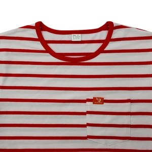 Detail of red and white striped t-shirt with crew neck and pocket logo tag