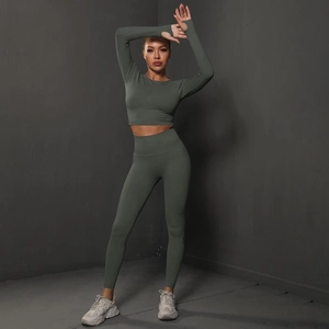Detail of seamless scrunch leggings and long sleeve crop top gym set on model