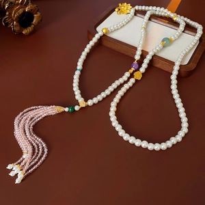 Elegant beaded floral necklace with colorful glass beads and a tassel pendant