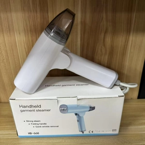 Detail of portable steam iron with folding handle and transparent water tank on packaging