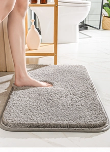 Close-up of soft grey microfiber bathroom mat showing absorbent thick shag texture