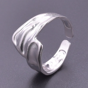 Polished silver adjustable ring with unique wavy texture in minimalist stainless steel style