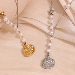 Chic 18K gold and silver seashell necklaces with star charms on beige silk
