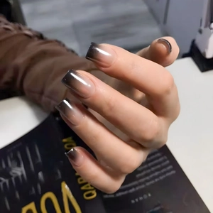 Black ombre long square press-on nails with a high-gloss finish for a minimalist chic look