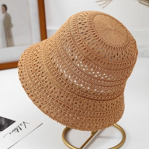 Women's hollow knit khaki sun bucket hat with breathable mesh on gold display stand