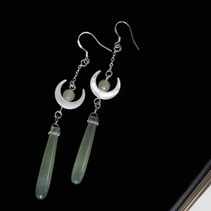Elegant silver tassel earrings with white crescent and light green teardrop pendants