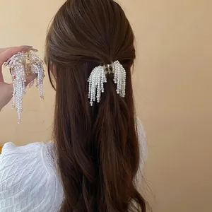 French style hair claw with faux pearls and long tassels for elegant women's hairstyles