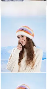 Close-up of fluffy rainbow faux fur beanie with woven label on snowy background