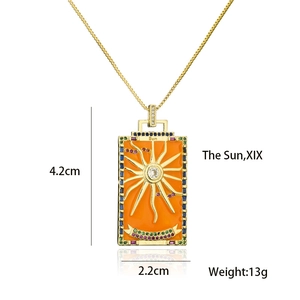 Detail of 18K gold plated tarot card pendant with Sun motif and colorful zircons