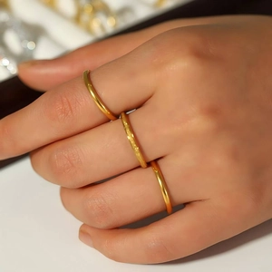Three-piece stackable 18k gold plated stainless steel rings with polished and matte finishes
