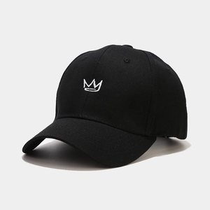 Close-up of a black cotton baseball cap with white crown embroidery at a 45-degree angle