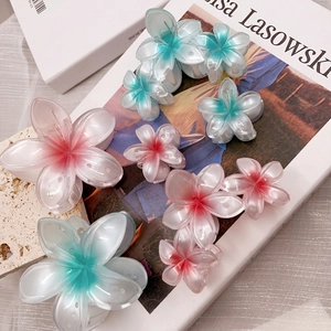 Frangipani flower hair claw clip set in pink and teal gradient resin for beach styling