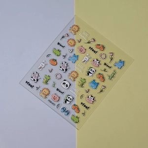 Detail of 5D embossed nail stickers featuring cute cartoon lions, pandas, and cows