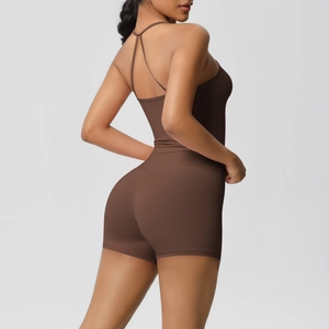 Detail of dark brown yoga bodysuit showing criss-cross straps and slim fit back design
