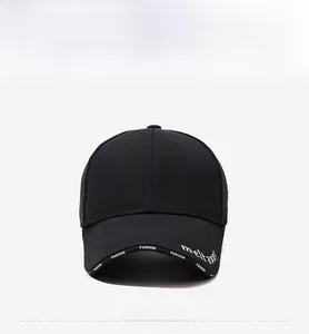 Close-up of a black baseball cap featuring white meltway and FASHION embroidery
