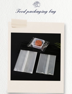 Close-up of food-grade transparent packaging bag with inner tray on wood background