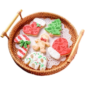 Christmas cookie cutters set featuring gingerbread man, tree and snowflake shapes