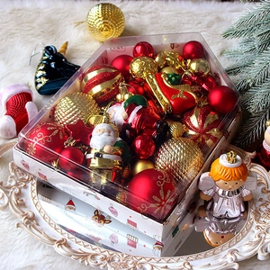 72-piece Christmas ornament set with red and gold baubles and Santa figurines in a gift box