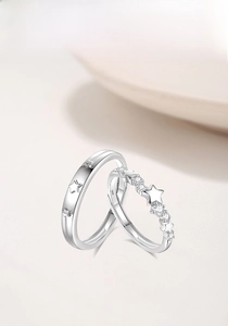 Detailed view of S925 sterling silver star-themed couple rings with zircon inlays