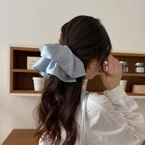 Elegant light blue satin oversized hair scrunchie with soft silk luster for women