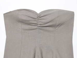 Detail of grey linen blend tube top featuring a sweetheart neckline and pleated bust texture