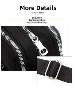 Detail of premium silver metal zippers and adjustable nylon strap on a black bag
