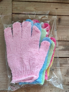 Detail view of five colorful mesh exfoliating bath gloves in transparent packaging