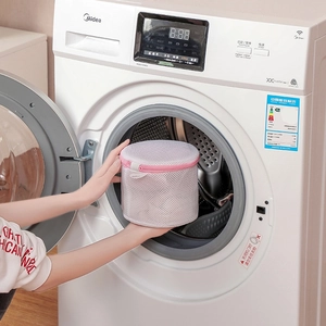 Cylindrical mesh laundry bag with pink zipper for protecting delicate clothes in washer