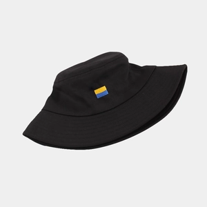 Detailed close-up of the Ukraine flag embroidery on a black cotton bucket sun hat