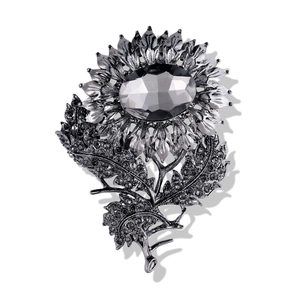 Vintage sunflower brooch with grey crystal gemstone and rhinestones in silver tone