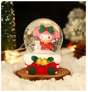 Close-up of My Melody Christmas snow globe featuring a festive holiday scene and resin base