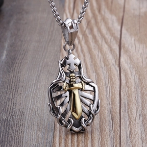 Hip hop stainless steel shield and gold sword pendant necklace on wooden background