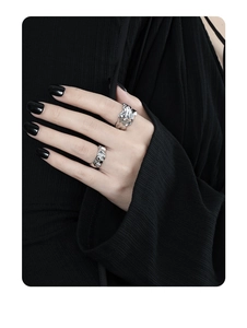 Close-up of S925 sterling silver rings with unique irregular textured surface on fingers