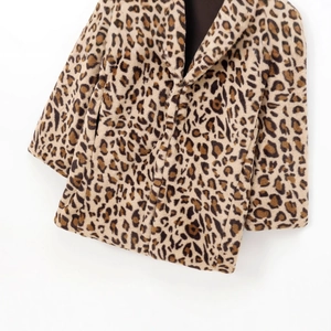 Women's leopard print faux fur coat with long sleeves and soft plush texture