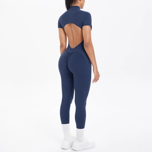 Detail of navy blue yoga jumpsuit featuring a heart-shaped back cutout and ruched booty seam