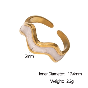 Detail of 18k gold wavy ring with white enamel showing 17.4mm diameter and 6mm width