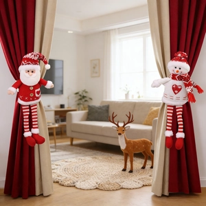 Detail of Santa and Snowman knitted curtain tiebacks in a festive living room setting