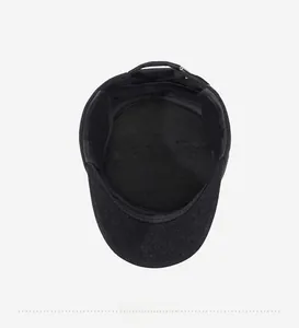 Detail of the inner lining and adjustable metal buckle on this men's black winter flat cap