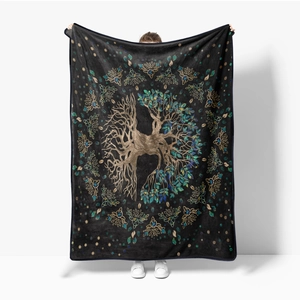 Detail of soft flannel throw blanket featuring a large colorful Tree of Life pattern