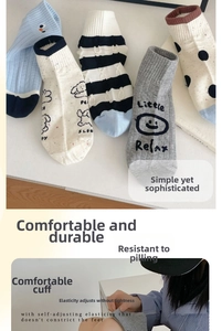 Detail view of cotton ankle socks featuring polka dots, stripes and cartoon animal patterns