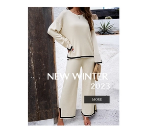 Detail view of knitted two-piece set featuring contrast piping and side slit hem design