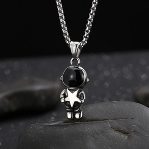 Stainless steel astronaut pendant with silver finish and black star detail on box chain