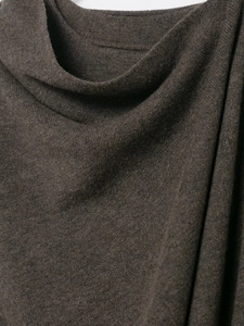 Close-up of soft dark brown knit fabric showing rich texture and wool material