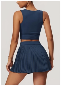 Back view of dark blue breathable yoga tank top and pleated skirt set for fitness