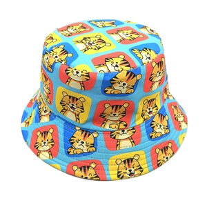 Reversible bucket hat featuring colorful cartoon tiger patterns and blue checkered design