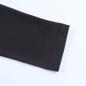 Close-up of black long sleeve cuff with high-quality double-needle stitching detail