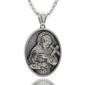 Detailed close-up of a silver stainless steel religious portrait pendant with engraving