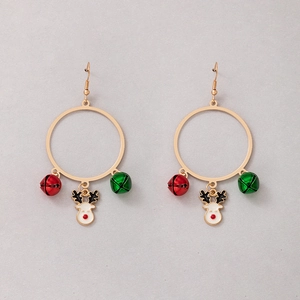 Close-up of Christmas earrings with gold reindeer charms and festive colorful bells