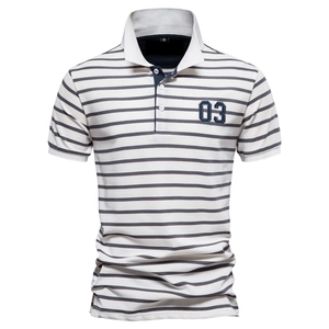 Close-up of white and navy striped cotton polo shirt collar and number 03 patch embroidery